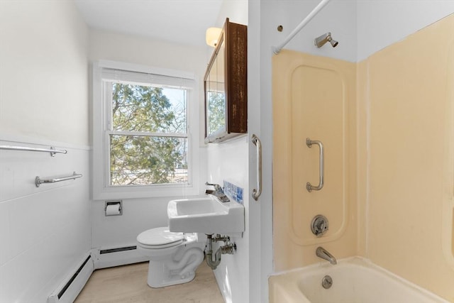 full bath featuring a baseboard radiator, toilet, bathing tub / shower combination, and a sink