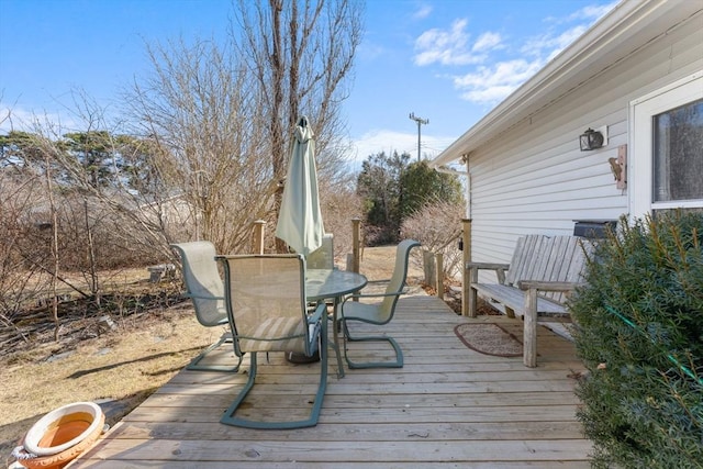 deck with outdoor dining space