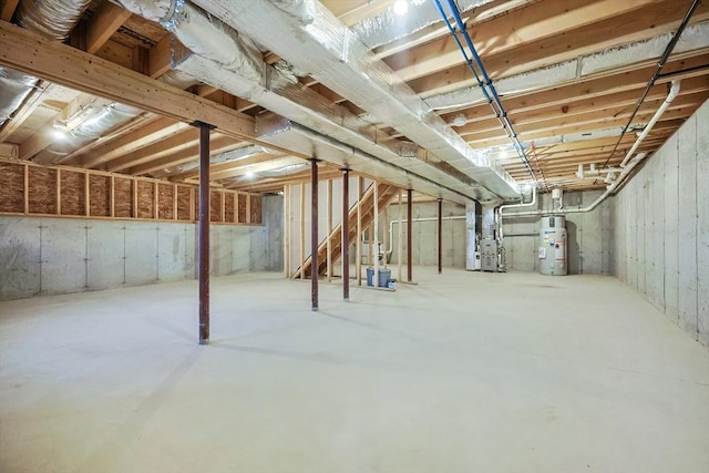 basement with electric water heater and heating unit