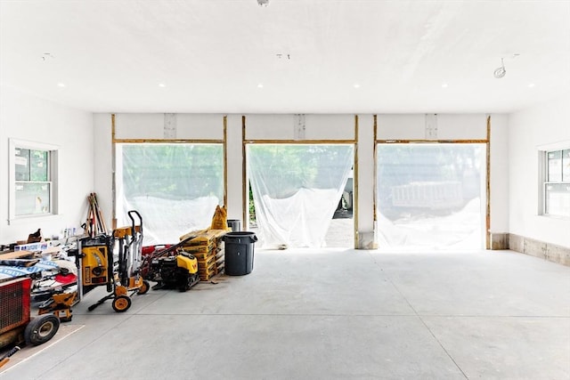 unfurnished room featuring concrete flooring