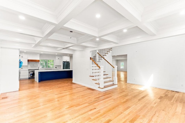 unfurnished living room featuring light wood-style floors, stairway, beam ceiling, coffered ceiling, and recessed lighting