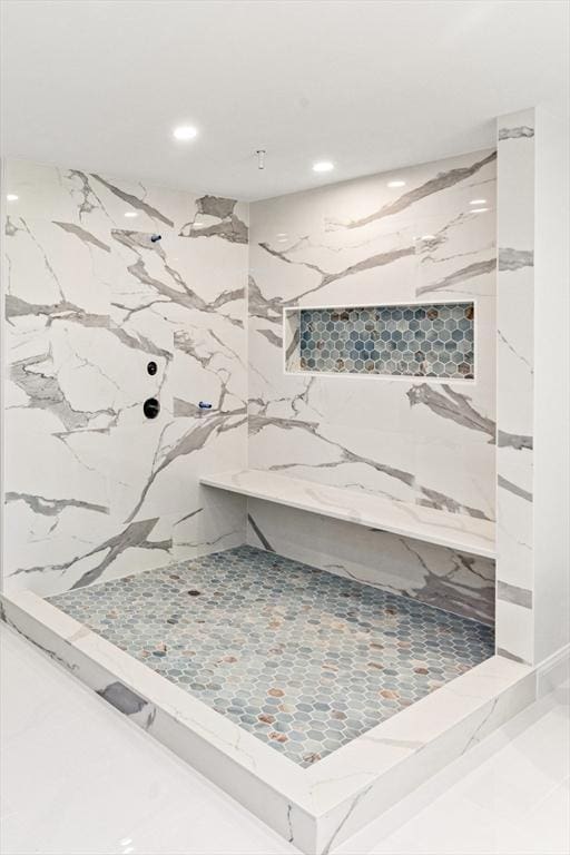 bathroom with recessed lighting and a marble finish shower
