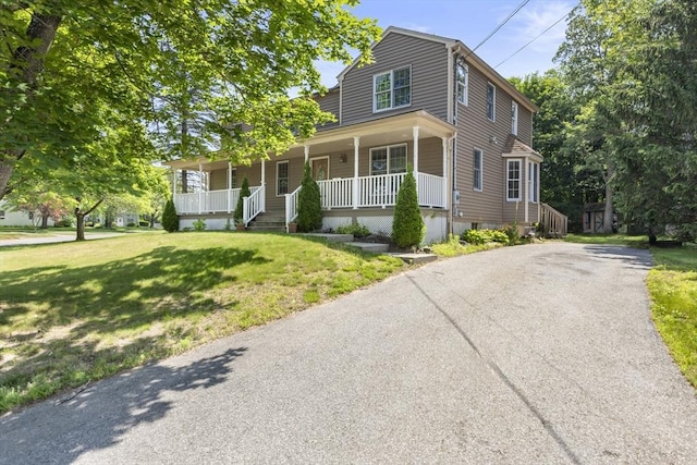 25 Hamilton Rd, Northborough, MA 01532 - view of front of home featuring covered porch, a front lawn, and asphalt driveway