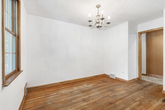 25 Hamilton Rd, Northborough, MA 01532 - spare room featuring a chandelier and wood-type flooring