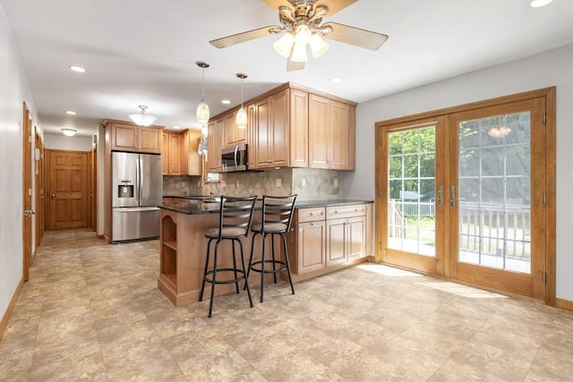 25 Hamilton Rd, Northborough, MA 01532 - kitchen featuring stainless steel appliances, a peninsula, decorative backsplash, a ceiling fan, and recessed lighting