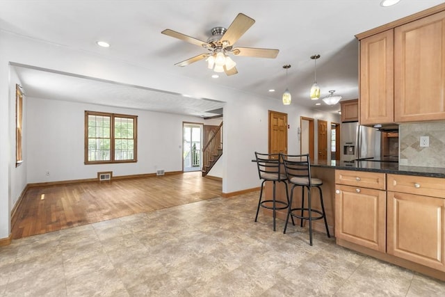 25 Hamilton Rd, Northborough, MA 01532 - kitchen featuring recessed lighting, light wood finished floors, a kitchen bar, tasteful backsplash, and open floor plan