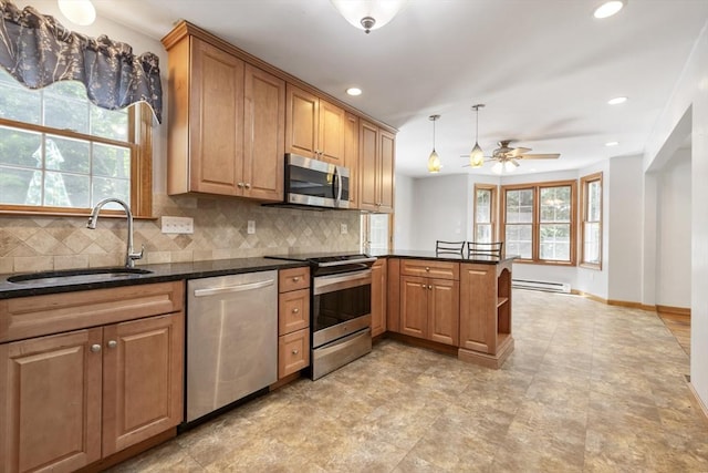25 Hamilton Rd, Northborough, MA 01532 - kitchen featuring stainless steel appliances, decorative backsplash, a peninsula, recessed lighting, and a ceiling fan