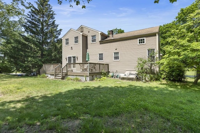 25 Hamilton Rd, Northborough, MA 01532 - back of property featuring a deck, a yard, and a chimney