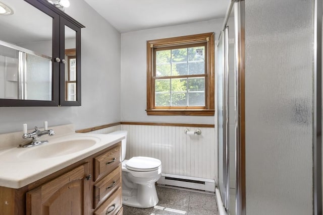 25 Hamilton Rd, Northborough, MA 01532 - bathroom with a baseboard heating unit, wainscoting, a shower stall, vanity, and granite floors
