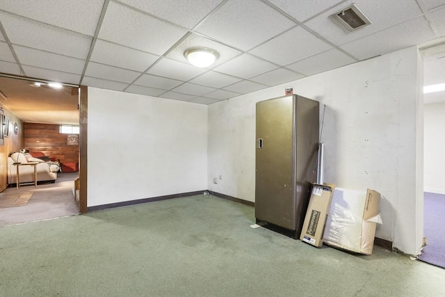 25 Hamilton Rd, Northborough, MA 01532 - below grade area with a drop ceiling, carpet floors, and wooden walls