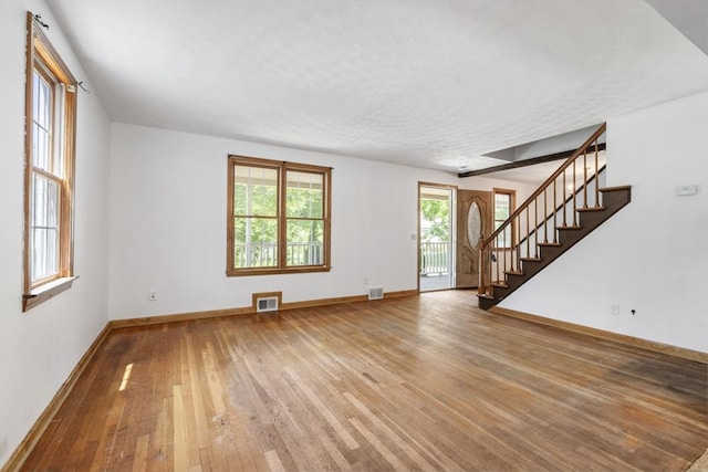 25 Hamilton Rd, Northborough, MA 01532 - unfurnished living room with hardwood / wood-style flooring and stairway