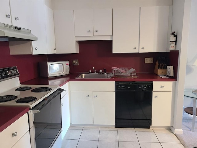 kitchen featuring under cabinet range hood, light tile patterned flooring, white appliances, white cabinetry, and a sink