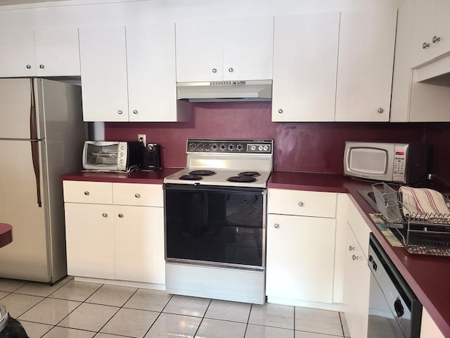 kitchen featuring white cabinetry, white appliances, light tile patterned flooring, and under cabinet range hood