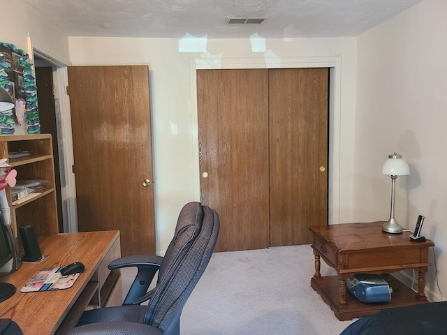 office space featuring visible vents and carpet floors