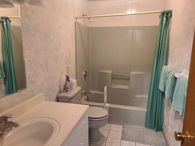 full bathroom featuring vanity, wallpapered walls, shower / bath combo with shower curtain, tile patterned floors, and toilet