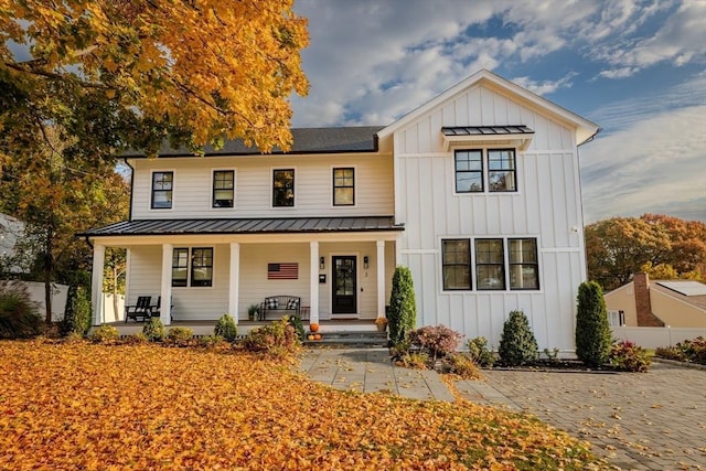 modern farmhouse style home with covered porch