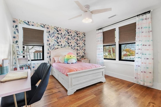 bedroom featuring ceiling fan and hardwood / wood-style floors