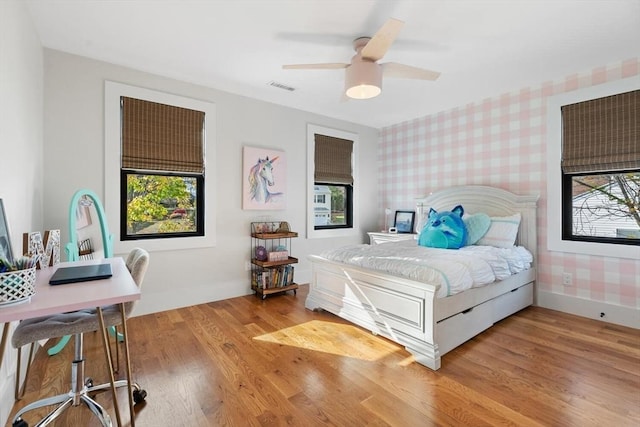 bedroom with ceiling fan and light wood-type flooring