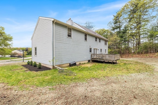 18 Candlewood Dr, Medway, MA 02053 - view of property exterior featuring a deck and a chimney