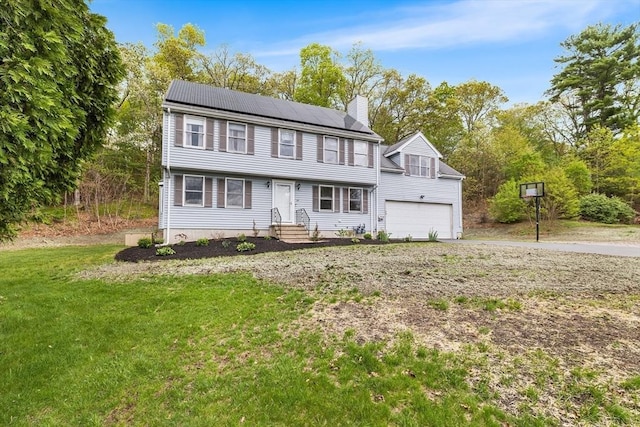 18 Candlewood Dr, Medway, MA 02053 - colonial-style house with a chimney, a front lawn, roof mounted solar panels, an attached garage, and driveway