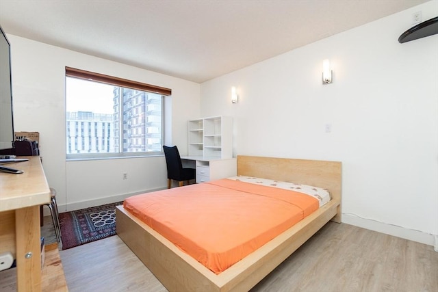 8-12 Museum Way Unit 1302, Cambridge, MA 02141 - bedroom with light wood-style floors and a desk
