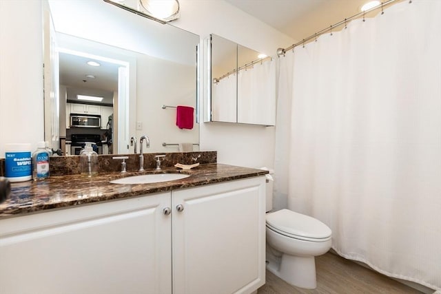 8-12 Museum Way Unit 1302, Cambridge, MA 02141 - full bathroom with vanity, wood finished floors, and curtained shower