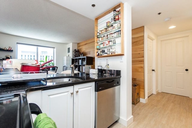 8-12 Museum Way Unit 1302, Cambridge, MA 02141 - kitchen featuring stainless steel dishwasher, white cabinets, light wood-type flooring, open shelves, and wooden walls
