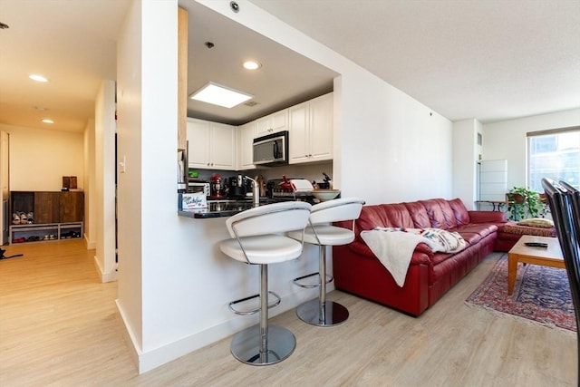 8-12 Museum Way Unit 1302, Cambridge, MA 02141 - living room featuring light wood-style flooring and recessed lighting