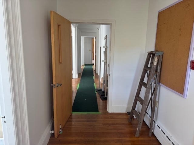 hallway featuring dark wood-type flooring