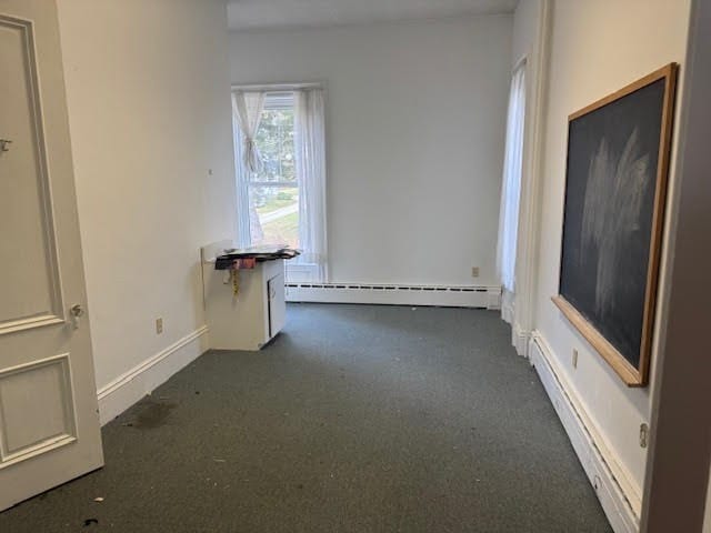 spare room featuring baseboard heating