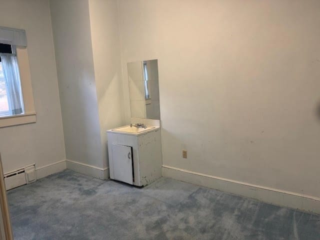 bathroom featuring vanity and a baseboard heating unit