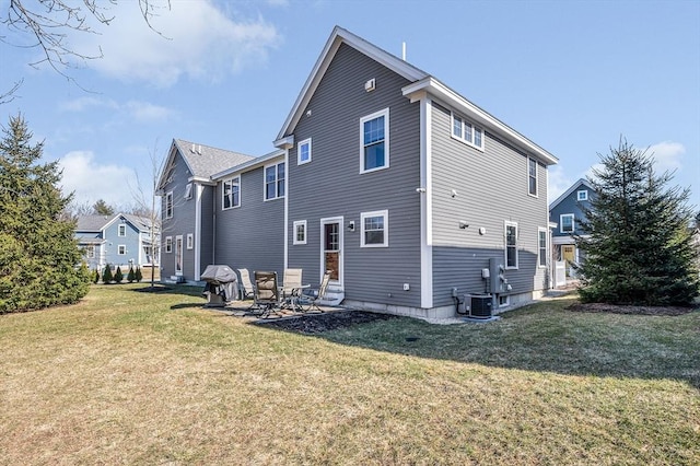 back of property featuring a yard, cooling unit, and entry steps