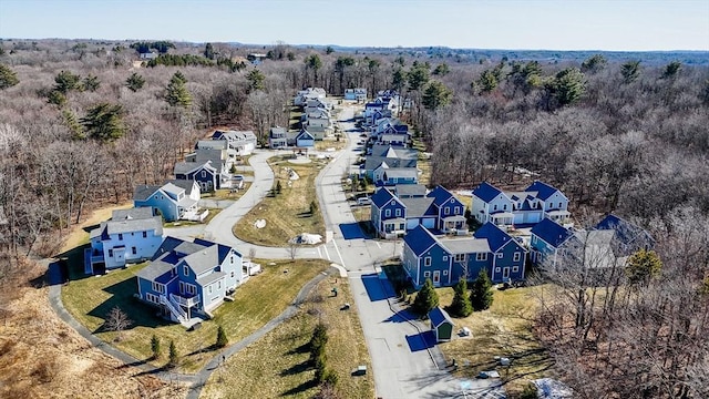 bird's eye view featuring a residential view and a view of trees