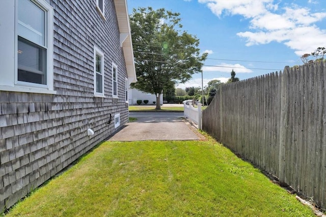 view of yard featuring a patio area and fence