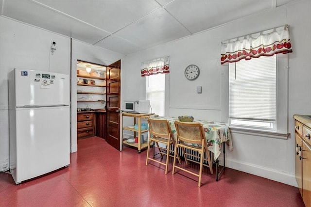 dining room featuring baseboards