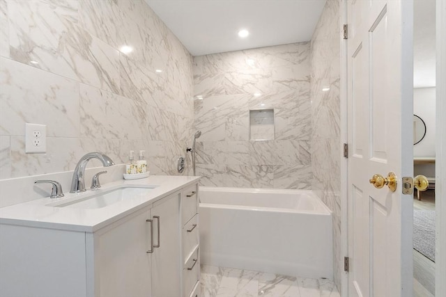 bathroom featuring shower / bath combination, marble finish floor, and vanity