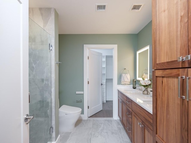 full bath featuring marble look tiles, a shower stall, double vanity, toilet, and baseboards