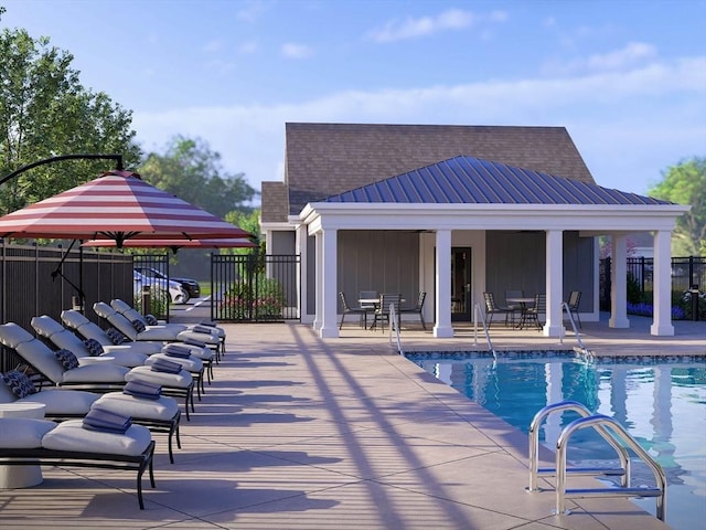 community pool featuring fence and a patio