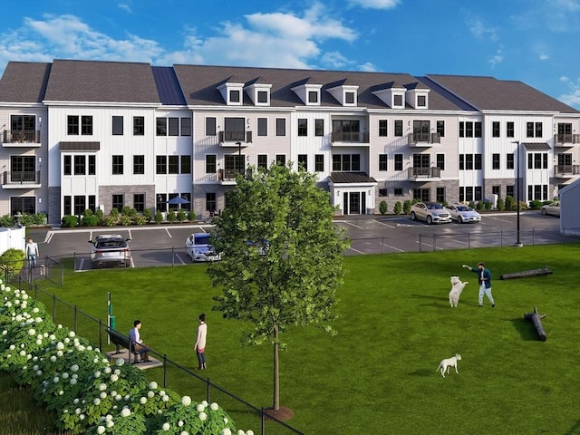view of property's community with uncovered parking