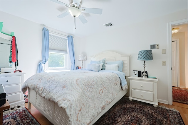 bedroom featuring dark wood-type flooring and ceiling fan