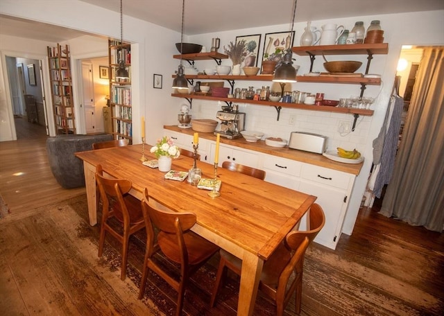 dining room with dark wood-type flooring