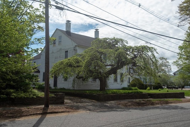 view of side of property with a chimney