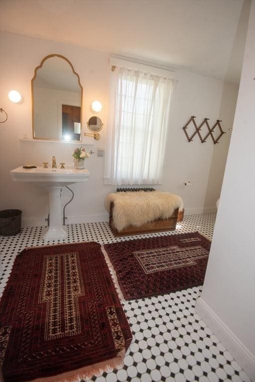 bathroom with tile patterned flooring and baseboards