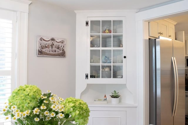 24 Garey St, Weymouth, MA 02189 - kitchen view of freestanding refrigerator, light countertops, and white cabinetry