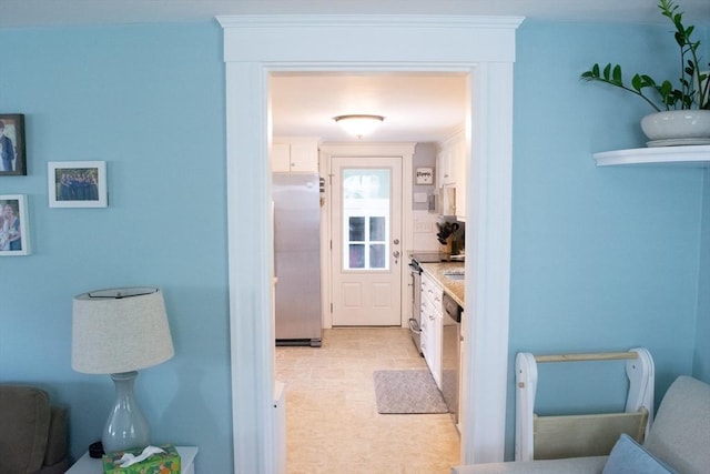 24 Garey St, Weymouth, MA 02189 - kitchen featuring freestanding refrigerator and white cabinetry