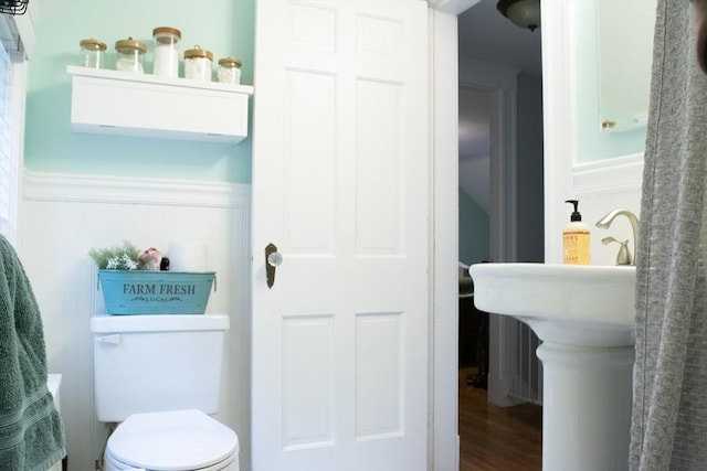 24 Garey St, Weymouth, MA 02189 - bathroom featuring wainscoting and wood finished floors