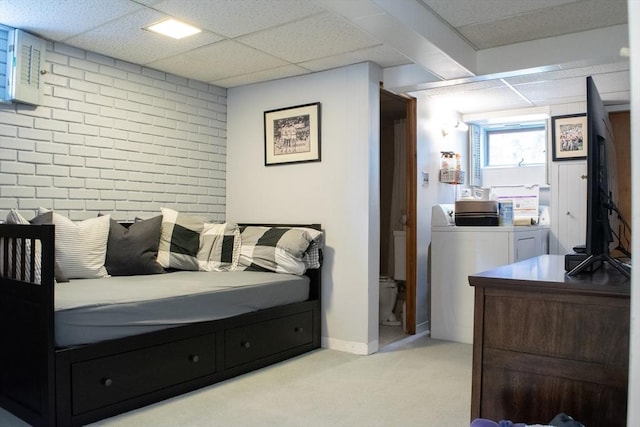 24 Garey St, Weymouth, MA 02189 - bedroom featuring washing machine and dryer, a drop ceiling, light carpet, and brick wall