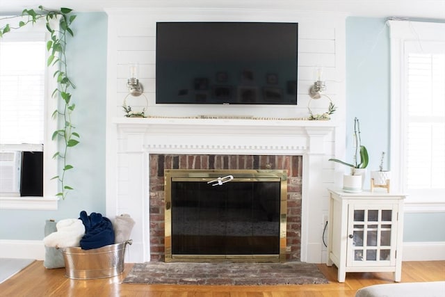 24 Garey St, Weymouth, MA 02189 - detailed view of a brick fireplace and wood finished floors