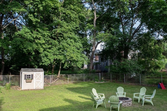 24 Garey St, Weymouth, MA 02189 - fenced backyard with an outdoor fire pit and a storage shed