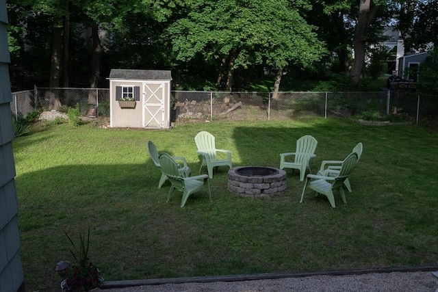 24 Garey St, Weymouth, MA 02189 - fenced backyard with an outdoor fire pit and a storage shed